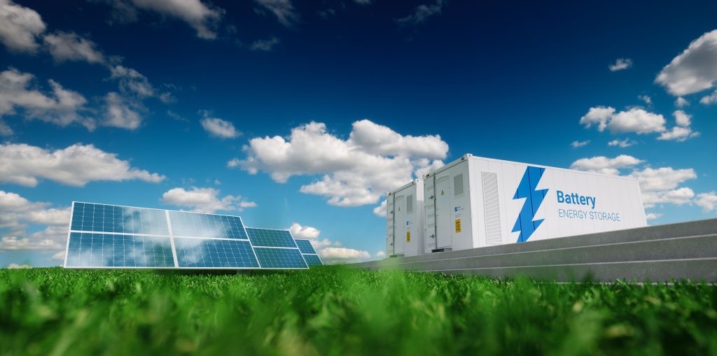 A 3d rendering of a energy storage system. Renewable energy - photovoltaics, wind turbines and Li-ion battery container in fresh nature.